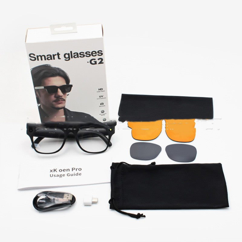 Smart glasses G2 with packaging, usage guide, and additional lenses on a white background