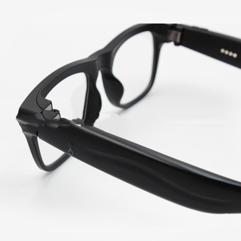 Close-up of black eyeglasses on a white background