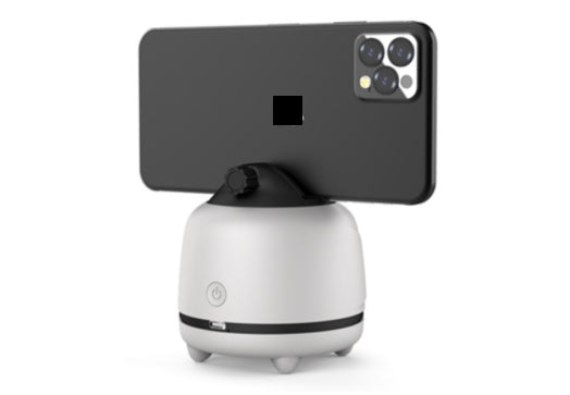 White phone holder with a black smartphone on a white background